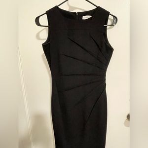 Calvin Klein size 0 petite cocktail dress fitted with starburst detail.